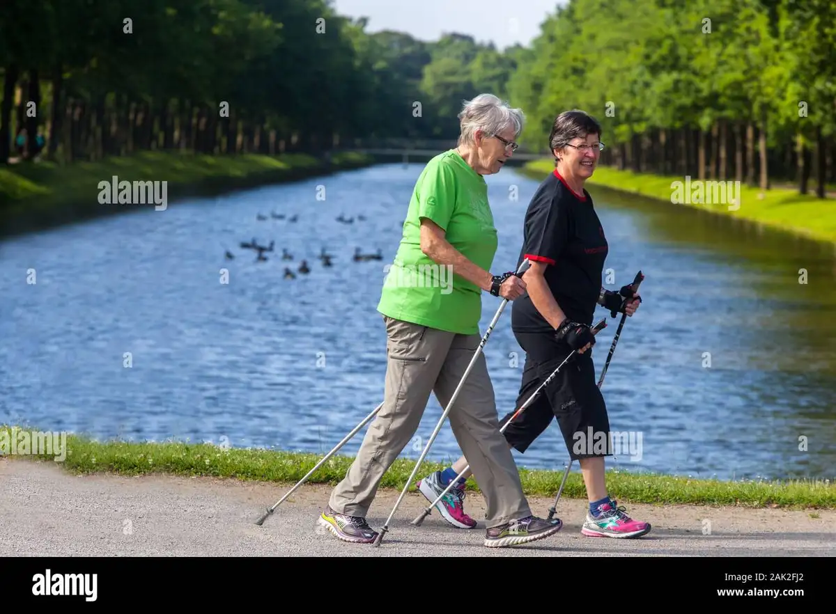 happy mature people walking in city park Germany