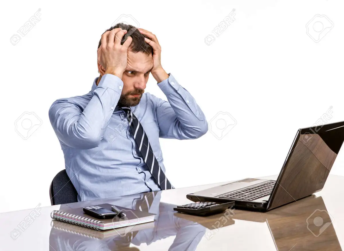 stressed business person at desk office paperwork burnout germany