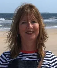 senior man using tablet, modern home atmosphere