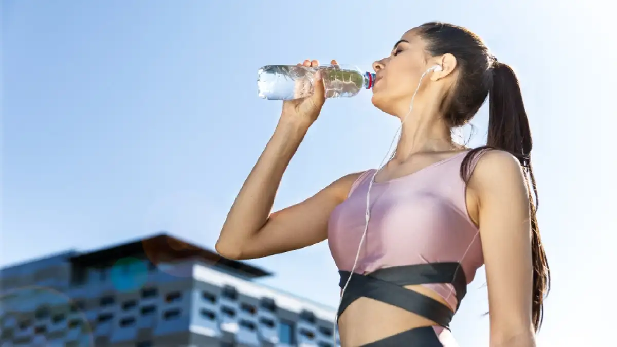 beautiful woman drinking water before meal, healthy skin glow