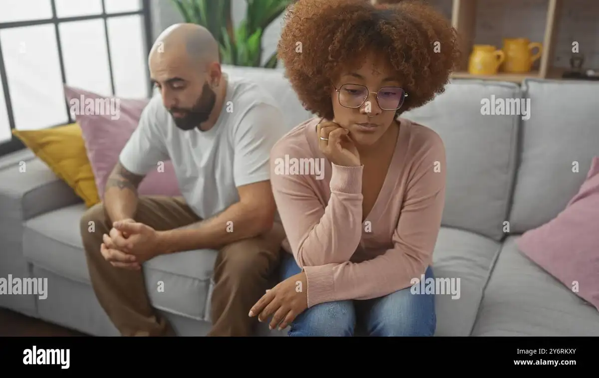couple sitting apart looking thoughtful