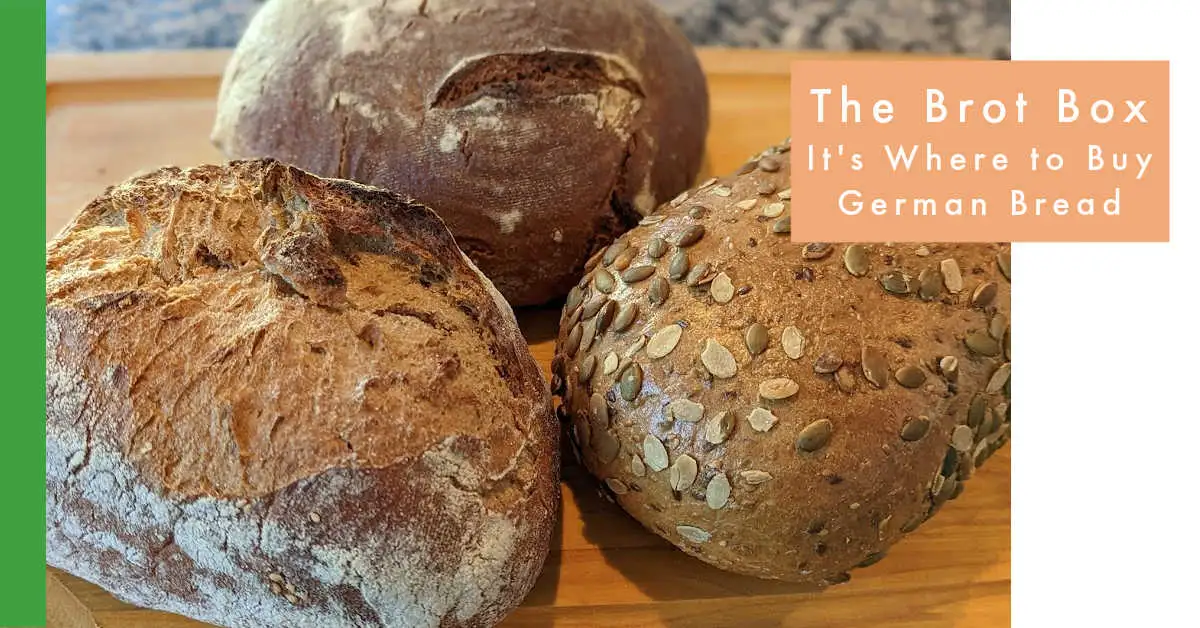 bread box with sliced bread and potato inside german home
