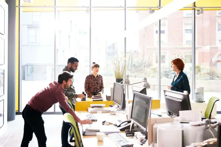 confident solo worker modern workspace sunlight