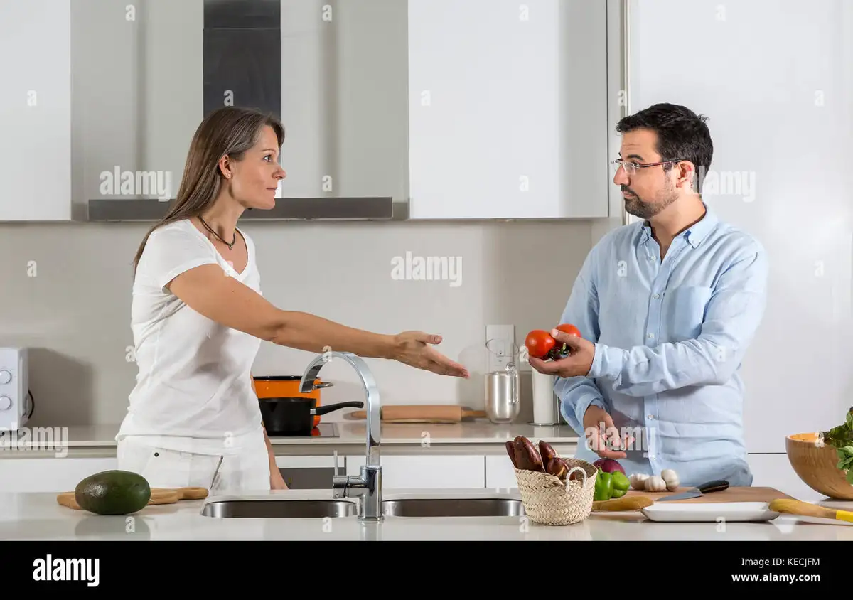couple arguing everyday problems kitchen realistic emotion