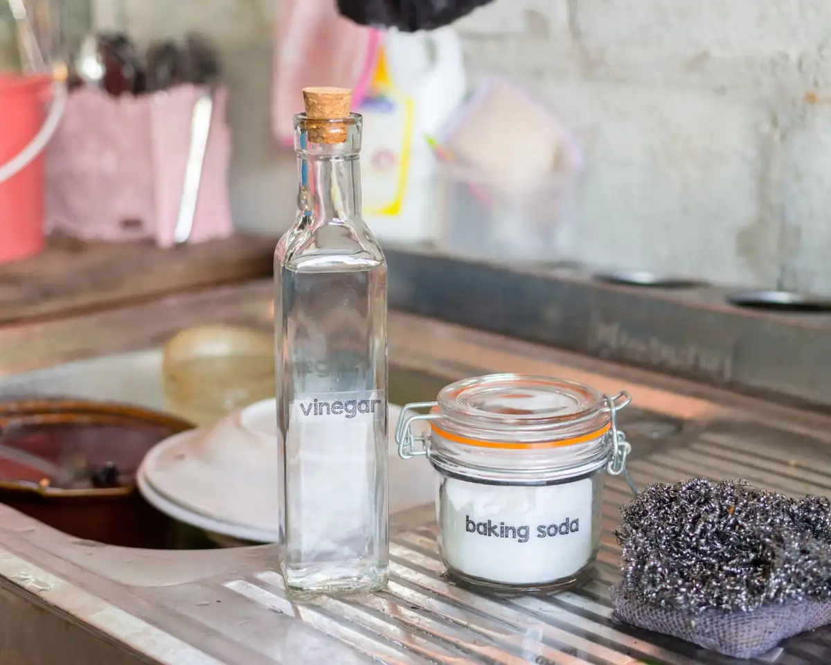 cleaning kitchen surfaces with vinegar bottle